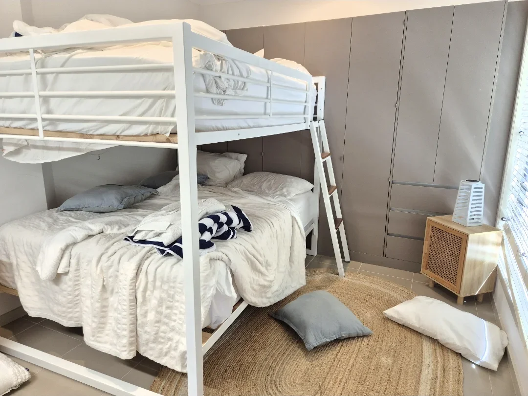 Bunk bed room before Airbnb clean
